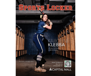 girl holding baseball bat in locker room