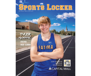 male athlete on running track with arms crossed